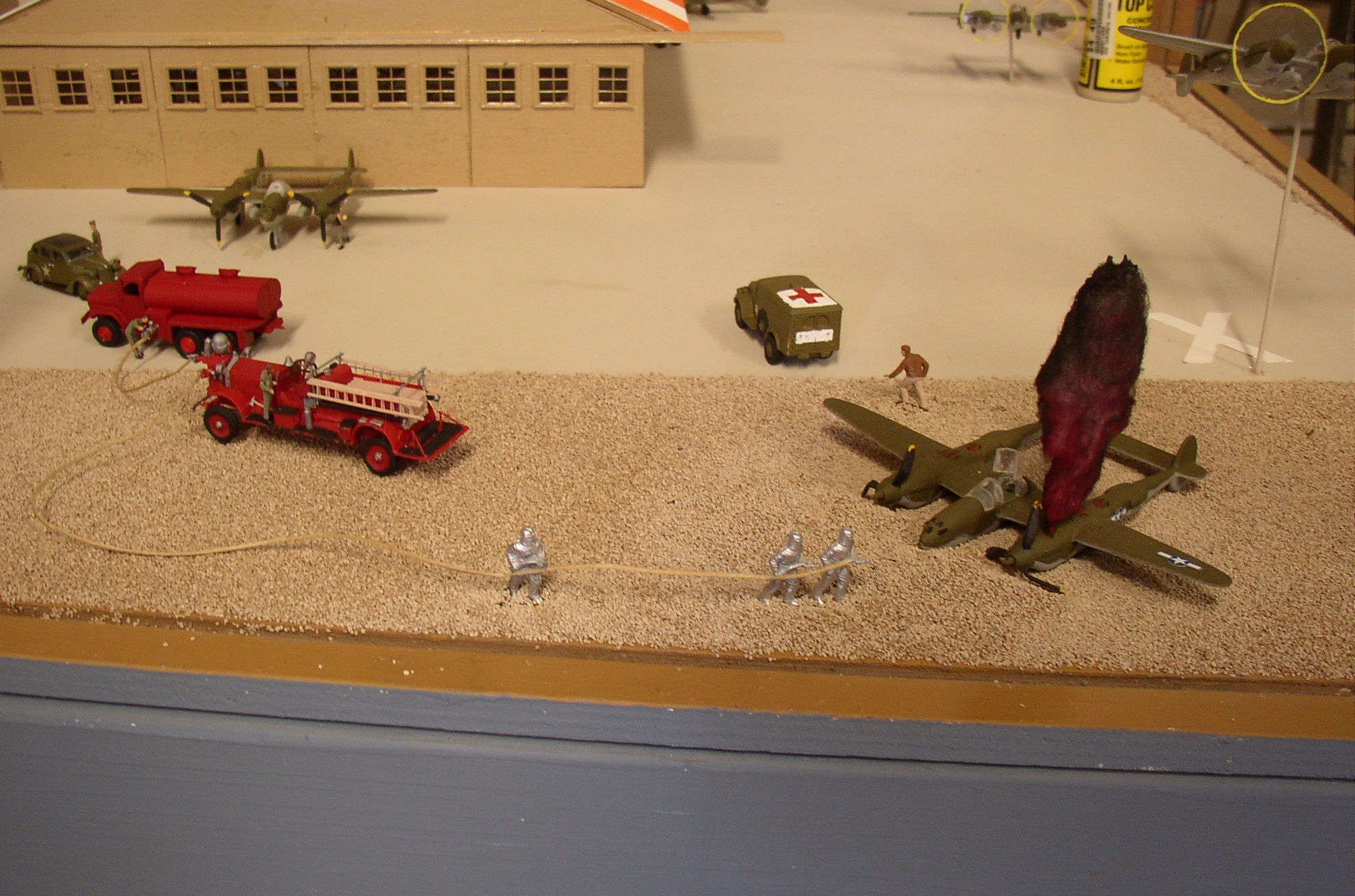 Diorama Uh-oh. Pilot running to safety after a crash. Cue the fire trucks.